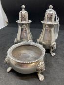 Hallmarked silver and white metal three piece condiment set. One hallmarked Birmingham 1933, the