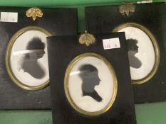 18th cent. Silhouettes of women in papier mache frames, one bears an old collection label on the