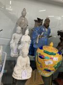 Chinese Blanc de Chine porcelain figures, Buddha seated in a Lotus posture, Guanjin standing