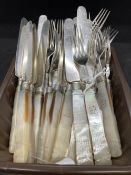 Set of twelve mother of pearl handled knives and twelve forks, the handles engraved with a Talbot.