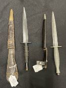 Edged Weapons: Commando Fairburn Sykes daggers in leather sheaths, one marked with cross key