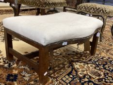 19th cent. Oak serpentine front footstool, lined, seated webbing and stuffing require restoration.
