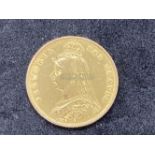 Gold coins: Victorian 1887 Half Sovereign. Weight 3.9g.