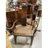 China/Far East: 19th/20th cent. Hardwood yoke back carver chairs with rattan seats. (2)