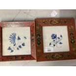 18th cent. Delft tiles, possibly Friesland, blue floral pattern, in later frames, a pair. 5½ins. x