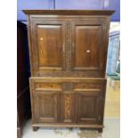 17th cent. Style oak cupboard with foliate carved stiles and inlaid bottom section, with stile feet.