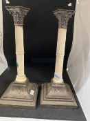 Silver: Pair of hallmarked silver and ivory desk candlesticks, the Corinthian capitols resting on