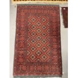 Carpets & Rugs: 20th cent. Turkman woolen carpet, red ground, six borders, geometric stylised