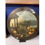 19th cent. Circular black lacquer ground painting of a stylised Neo Classical grand tour ruins.