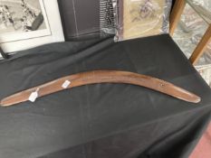 Tribal: Large Australian hardwood fighting boomerang with primitive carved decoration. 33ins.