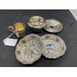 White metal pair of pierced and embossed dishes, a white gilt metal miniature cup and saucer (French