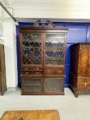 Large mahogany secretaire bookcase, the broken pediment top above a dental cornice above a frieze