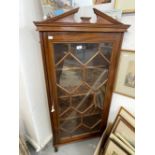 19th cent. Mahogany astragal corner display cabinet on three supports with broken pediment cornice,.