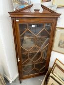 19th cent. Mahogany astragal corner display cabinet on three supports with broken pediment cornice,.