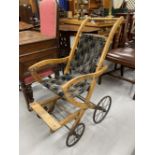 Early 20th cent. Beech framed children's pushchair.