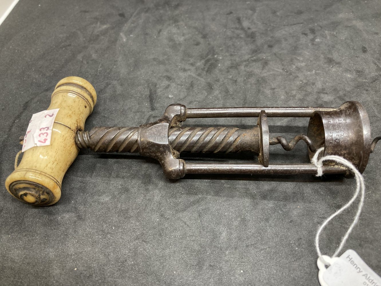 19th cent. Corkscrew in the manner of Thomason, two pillar with bone handle signed. 9½ins. Extended.