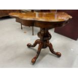 19th cent. Walnut card table, the serpentine shaped fold over swizzle top supported by a shaped