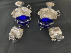 20th cent. Edwardian silver plated chamber sticks, a pair, plated napkin rings, a pair, and plated