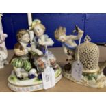 19th/20th cent. Ceramics: Naples Porcelain, figure of boy and girl seated, holding bunches of