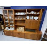 20th cent. 1970s G plan teak furniture. Suite of four wall units to include glazed bookcase over