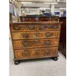 18th cent. Walnut chest of drawers on later bun feet. Two short over three long drawers, with