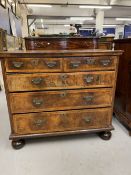 18th cent. Walnut chest of drawers on later bun feet. Two short over three long drawers, with