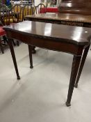 19th cent. Mahogany fold over top card table, the serpentine top on fluted legs terminating in block