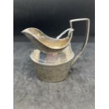 Hallmarked Silver (Irish): Cream jug reed patterned handle with bright cut engraving. Hallmarked