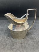 Hallmarked Silver (Irish): Cream jug reed patterned handle with bright cut engraving. Hallmarked