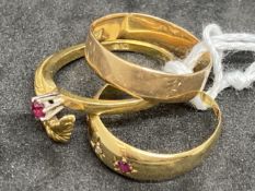 Hallmarked Jewellery: Three 18ct gold rings, one plain band, one set with a ruby, and one set with