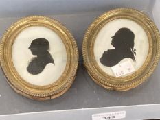 19th cent. Silhouettes of gentlemen in oval brass frames, label on back J. Miers miniature profile