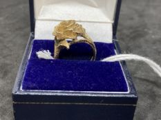 Hallmarked Jewellery: 9ct. gold dress ring, the head in the form of a rose. Weight 5.5g.