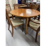 20th cent. Teak G plan circular dining table 44ins. Dia. Plus two slat back carvers and four