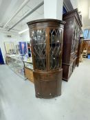 Late 19th cent. Mahogany glazed top bow front corner cupboard, the seventeen pane glass doors