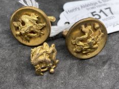 Yellow metal pair of cufflinks and tie tack, all with dragon motif, all test as 14ct gold. Total