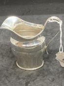 Hallmarked Silver: Cream jug, reed pattern handle, hallmarked Edinburgh. Weight 3.8oz.