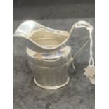 Hallmarked Silver: Cream jug, reed pattern handle, hallmarked Edinburgh. Weight 3.8oz.