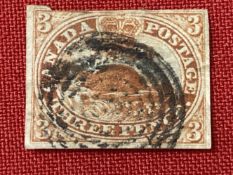 Stamps: Colony of Canada, 1851 SG1a, 3d Red, used, clipped top edge, multi circle cancel.