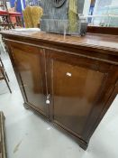 Early 20th cent. Mahogany two door cupboard on bracket supports with later internal additions.