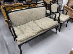 Ebonised salon set comprised of two seater sofa and two chairs with Cotswold Furniture Company label