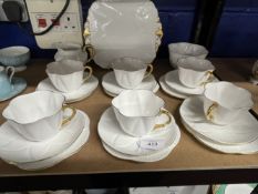 20th cent. Ceramics: Shelley 'Dainty' white and gilt tea china, six cups, saucers and side plates,