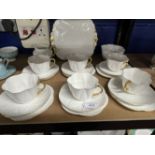 20th cent. Ceramics: Shelley 'Dainty' white and gilt tea china, six cups, saucers and side plates,