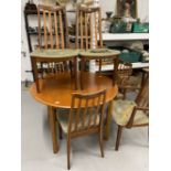 20th cent. Teak G plan circular dining table 44ins. Dia. Plus two slat back carvers and four chairs,