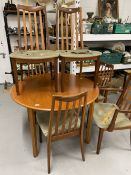20th cent. Teak G plan circular dining table 44ins. Dia. Plus two slat back carvers and four chairs,