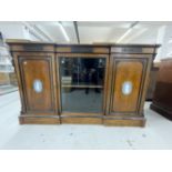 19th cent. Walnut break front bookcase attributed to Lamb of Manchester. Cross boarded top over a