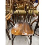 19th cent. Elm seated spindle back carver chair.