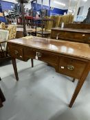 Early 19th cent. Mahogany small desk with three drawers, brass furniture on chamfered supports. 39½