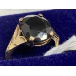 Hallmarked Jewellery: 9ct gold ring claw set with an oval cut garnet, estimated weight 5.00ct.