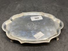 Hallmarked Silver: Georgian card tray, oval shaped, scalloped border on four reed and claw feet.