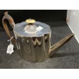 Hallmarked Silver: Georgian teapot, serpentine decorated body, hinged cover, wooden handle.